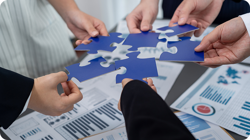Closeup-top-view-business-team-of-office-worker-putting-jigsaw-puzzle.png